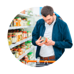 Image of shopper examining canned goods