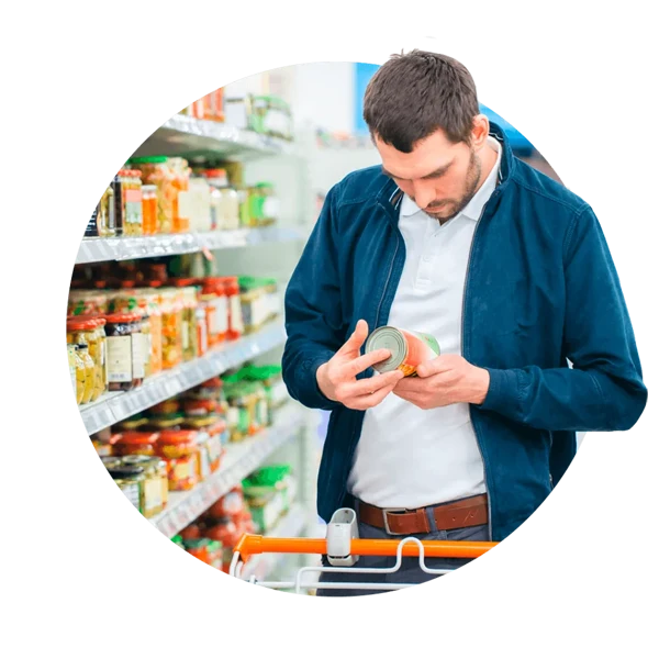 Person looking at tin in supermarket