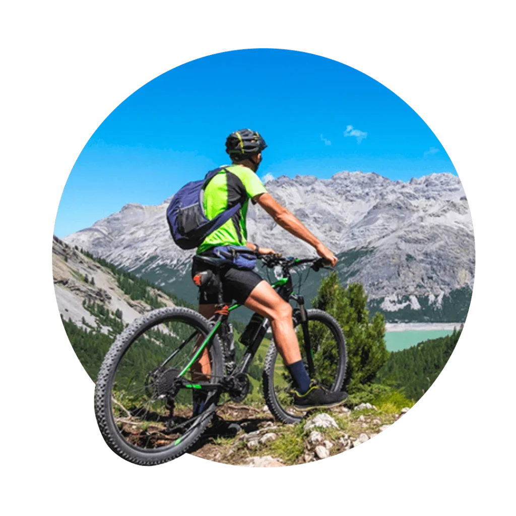 Person on bike looking at mountains