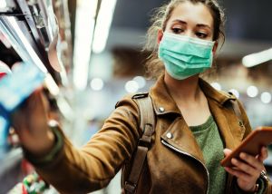 Shopper wearing facemask whilst shopping amid COVID pandemic