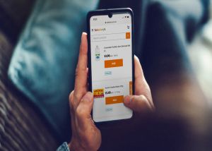 Image of person browsing Sainsbury's mobile app on phone