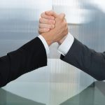 Image of handshake between two people signifying collaboration